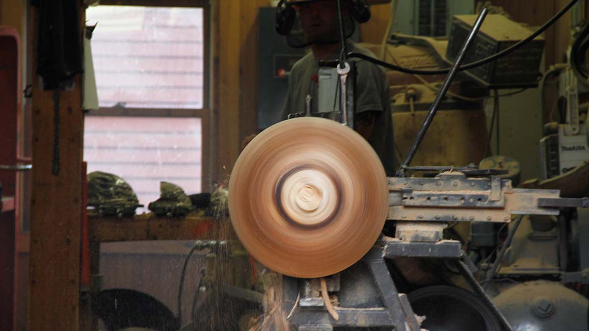 Wood bowls being hand turned in Spencer Peterman's studio in Gill, MA