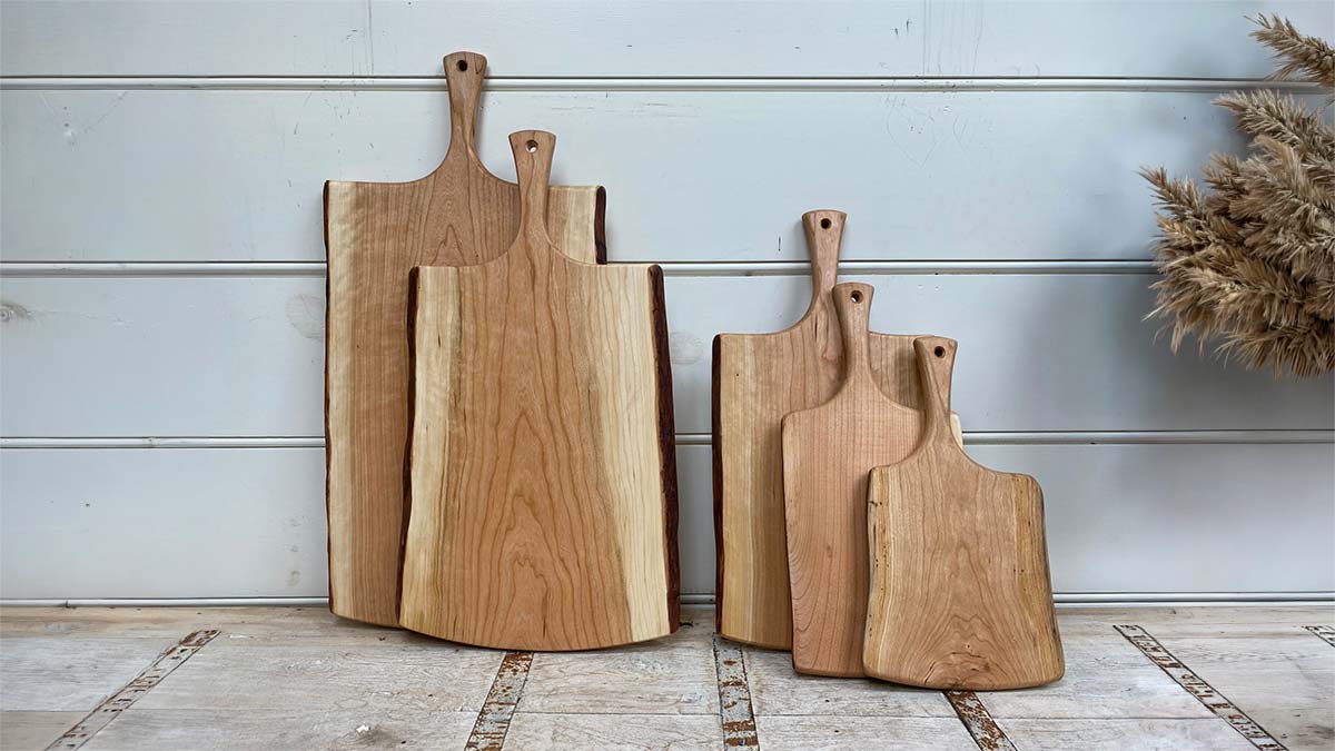 A set of handmade cherry wooden boards with handles